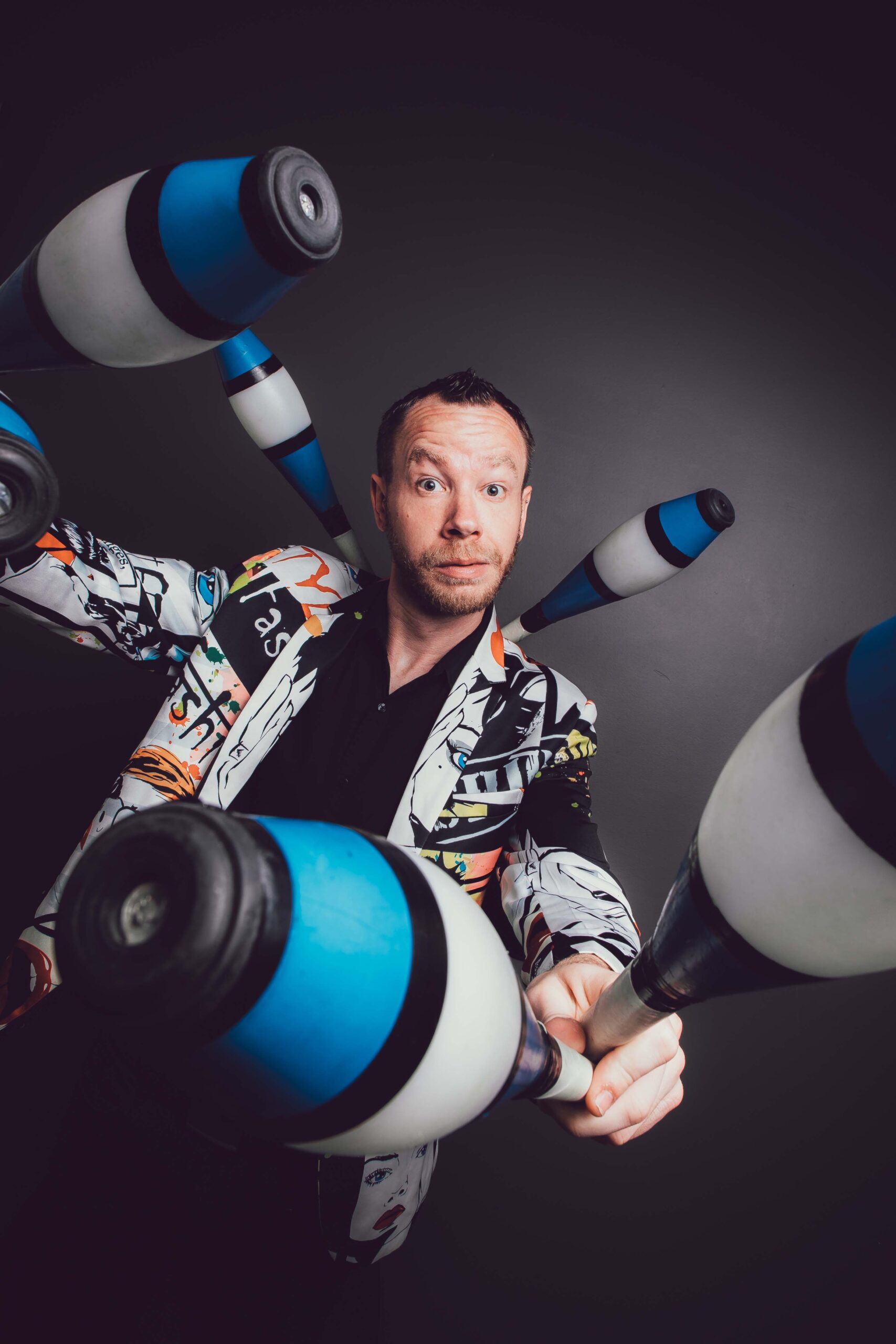 Professional headshot of James Bustar, comedy juggler