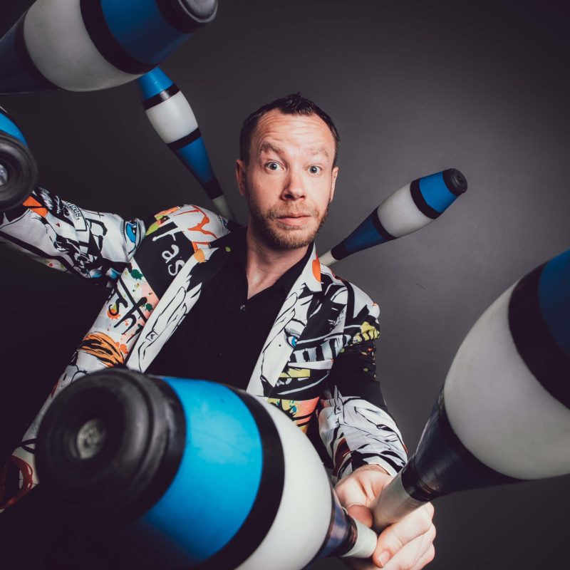 Professional headshot of James Bustar, comedy juggler